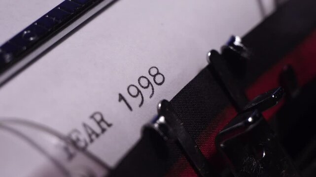 Year 1998, Typing on Blank White Paper in Vintage Typewriter, Close Up