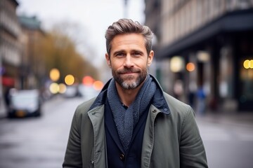 Fototapeta premium Portrait of a handsome middle-aged man on a city street.