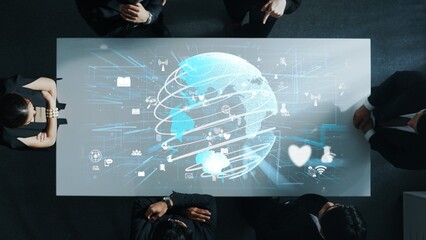 Top down aerial of business team brainstorm idea about digital communication or global network connection. Group of diverse business people discuss about data processing at meeting room. Directorate.