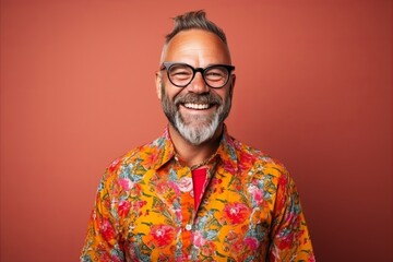 Fototapeta premium Portrait of a senior hipster man with glasses and a colorful shirt