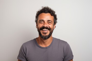 Obraz premium Portrait of a happy latin man smiling at the camera.