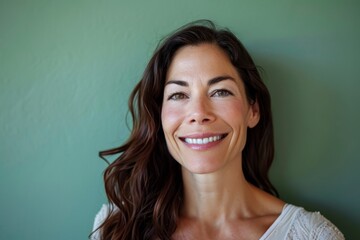 Close up portrait of a beautiful woman smiling and looking at the camera