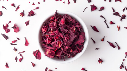 Top view of dried hibiscus or roselle fruits in the white bowl isolated on a white background