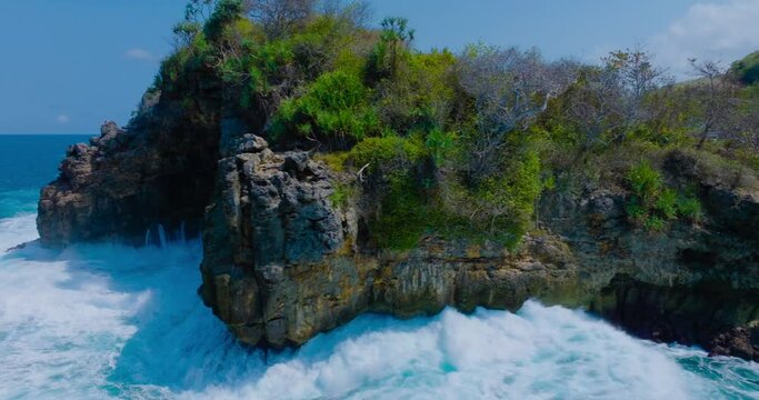 Edge of cliff hit by ocean wave