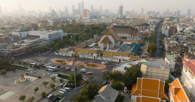 4k An Aerial view Hyperlapse Footage of the Red Giant Swing and Suthat Thepwararam Temple, The most famous tourist attraction in Bangkok, Thailand.