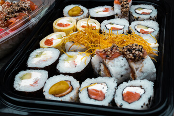 Sushi roll with salmon rice fried sweet potato cheese seaweed delivery
