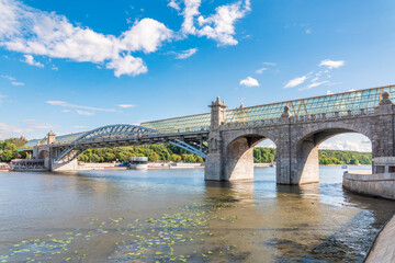 View of the Moscow river embakment, Pushkinsky bridge and cruise ships at sunset.