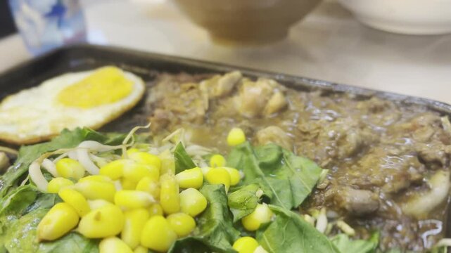 a very delicious mixed beef and chicken teppanyaki dish at a Japanese restaurant