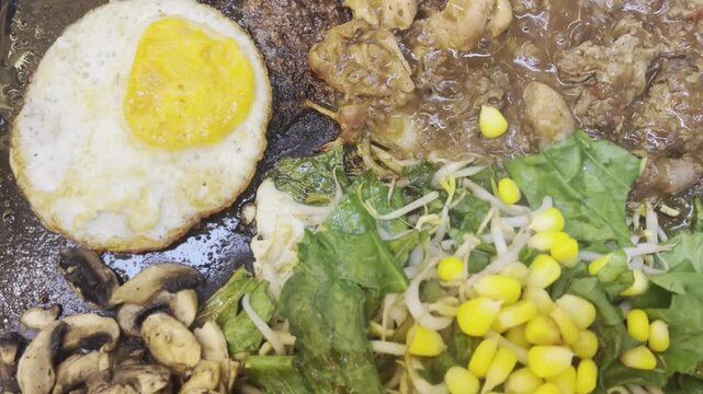 a very delicious mixed beef and chicken teppanyaki dish at a Japanese restaurant