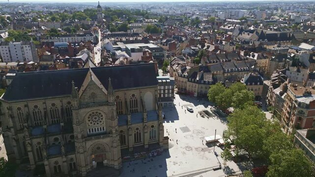 Basilica Saint-Aubin in Place Sainte Anne square, Rennes in France. Aerial drone sideways