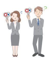 マルバツの札を持つスーツ姿の男女　正解　不正解　悩む