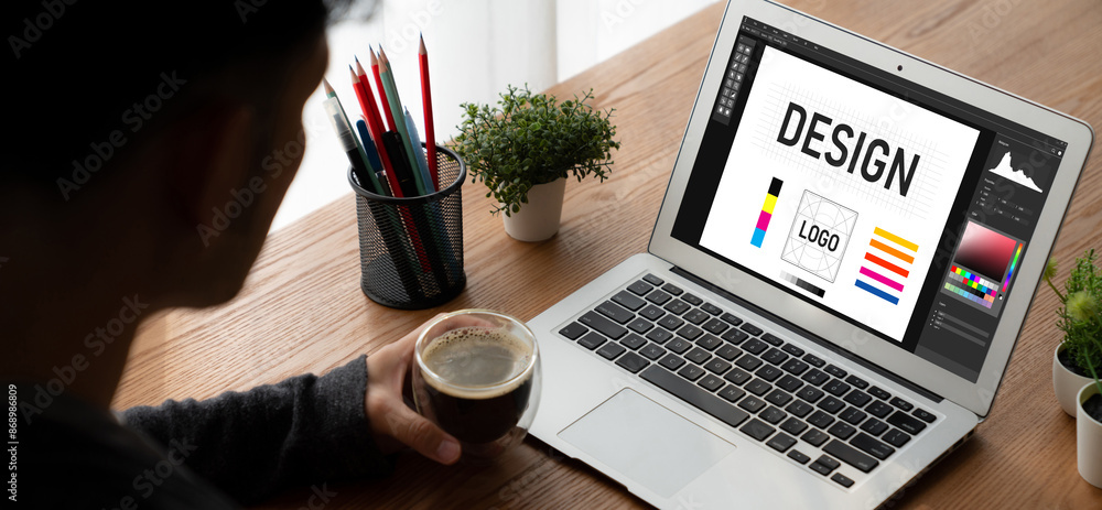 Poster graphic designer software for modern design of web page and commercial ads showing on the computer s