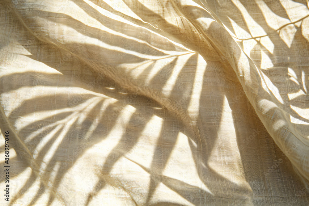 Poster blurred shadow of palm leaf on beige background, abstract shadow pattern for product presentation. m