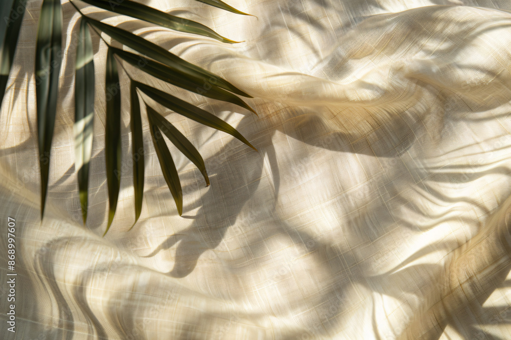 Poster blurred shadow of palm leaf on beige background, abstract shadow pattern for product presentation. m