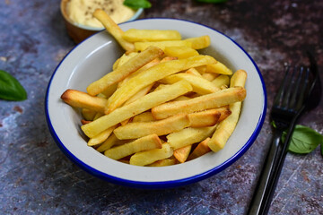  Home made   Fresh fried French fries  in a bowl on wooden rustic  background