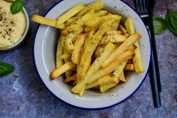  Home made   Fresh fried French fries  in a bowl on wooden rustic  background