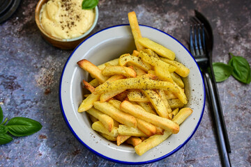  Home made   Fresh fried French fries  in a bowl on wooden rustic  background
