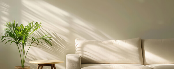 A cozy beige boucle sofa with a simple coffee table and greenery, embodying the essence of Japandi design