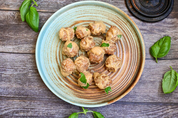 Homemade Swedish Meatballs  With creamy gravy sause in black pan skillet.Swedish cuisine.