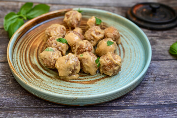 Homemade Swedish Meatballs  With creamy gravy sause in black pan skillet.Swedish cuisine.