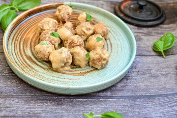 Homemade Swedish Meatballs  With creamy gravy sause in black pan skillet.Swedish cuisine.