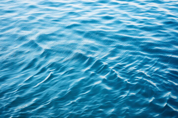 Closeup blurred blue sea background, top view surface blue water. abstract summer background.