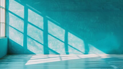 Obraz premium Serene blue room with strong shadow of window railing on the wall