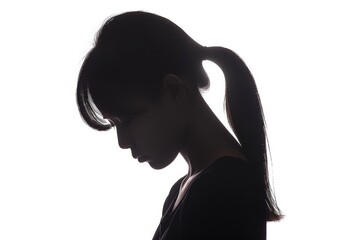 Silhouette of a young woman in contemplation