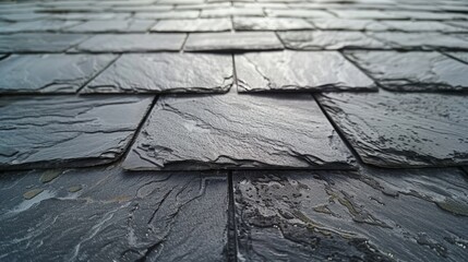 Wet slate roof tiles after rain closeup