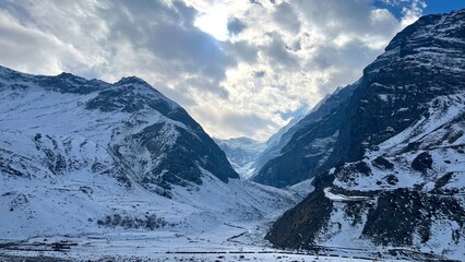 Panoramic view of Snow Mountains with blue skies.Alps and Blue Sky around Titlis mountain.Himalayan...