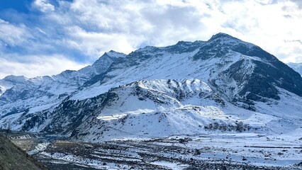 Panoramic view of Snow Mountains with blue skies.Alps and Blue Sky around Titlis mountain.Himalayan...