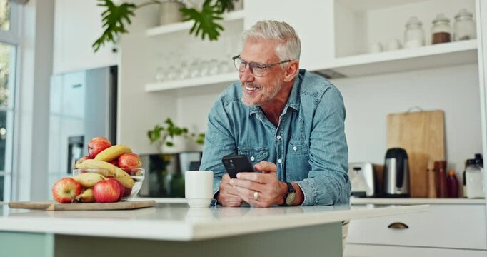 Phone, coffee and man in kitchen laughing at funny, comic or comedy joke online on blog. Happy, cellphone and mature male person with cappuccino reading silly email communication on internet at home.