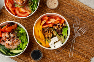 Fresh poke bowl on straw mat close up