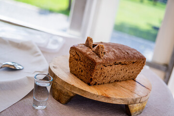 Empty Wedding Reception Hall With Loaf of Rye Bread on Wooden Serving Tray