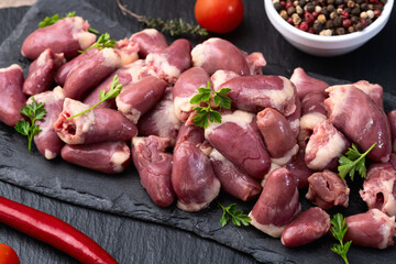Raw chicken giblets hearts , meat background