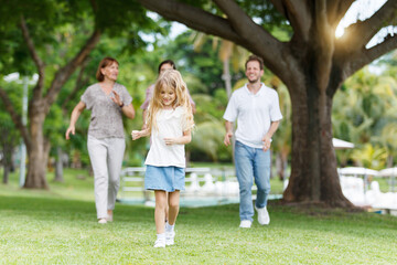 Naklejka premium Family with children walking at the park.