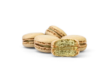 Macaroons with pistachio filling isolated on white background.