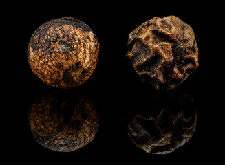 black pepper corns in detail with reflection
