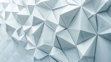 A close-up photograph of a contemporary geometric design featuring a pattern of white triangles on a soft white-grey background