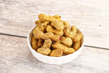 Raw ripe unpeeled peanut heap