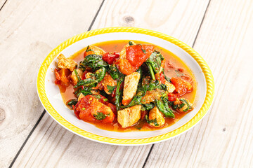 Chicken with tomato and spinach