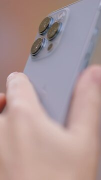 Beautiful young woman shooting a video . Action . A beautiful woman with long hair who shoots videos on an iPhone 13 pro with amazing accessories on it.