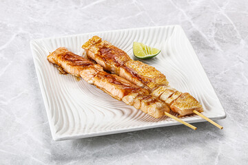 Grilled salmon skewer with sauce