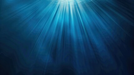 Beautiful underwater scene with sunlight beams penetrating deep blue water, creating a serene and tranquil aquatic environment.