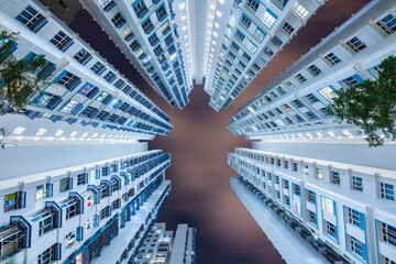 Bottom up view of dense residential building taken at night in Kallang district, Singapore