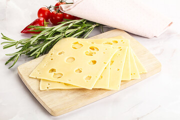 Sliced maasdam cheese with holes