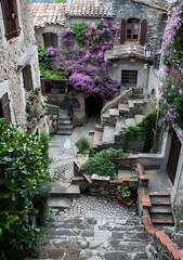 Stone Steps and Cobblestone Pathway in a Charming Old Town Courtyard