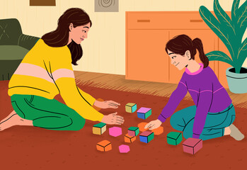 Mother and daughter playing with blocks at home