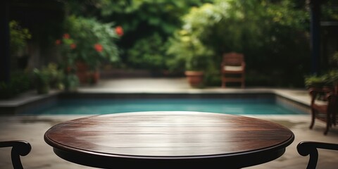 Obraz premium Wooden Table with Pool in Background