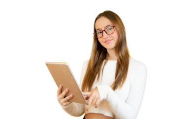 Portrait of a young girl standing holding a tablet looking to camera isolated over transparent background.